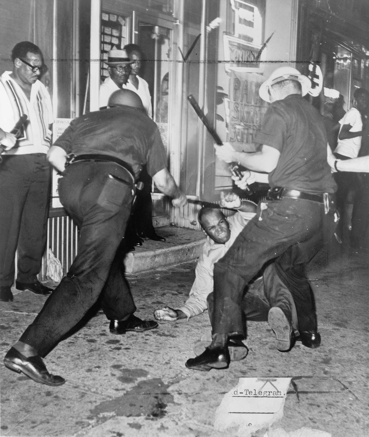 Police beat protestors during the Harlem Riots, New York. World Telegram & Sun photo by Dick De Marsico, 1964. Library of Congress. Public Domain. Police beat protestors during the Harlem Riots, New York. World Telegram & Sun photo by Dick De Marsico, 1964. Library of Congress. Public Domain.